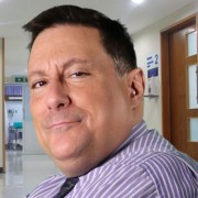 Dark-haired man in a medical setting